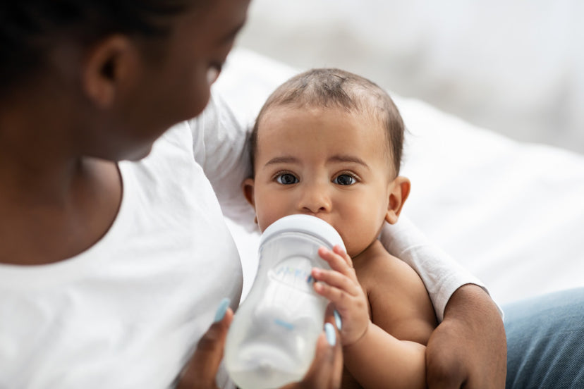 Mom feeding her baby a bottle